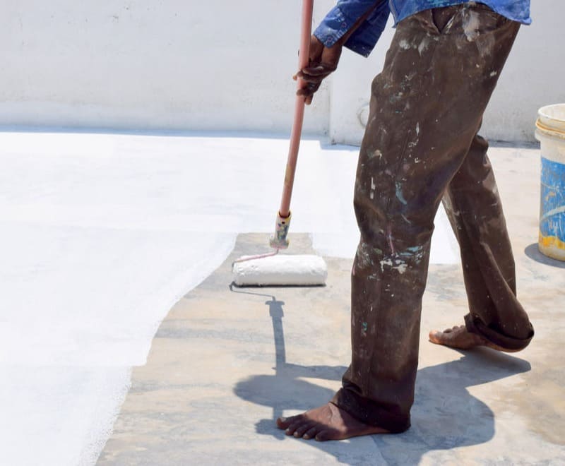 Nitito works on a waterproofing project. Waterproofing Contractors in Bangalore